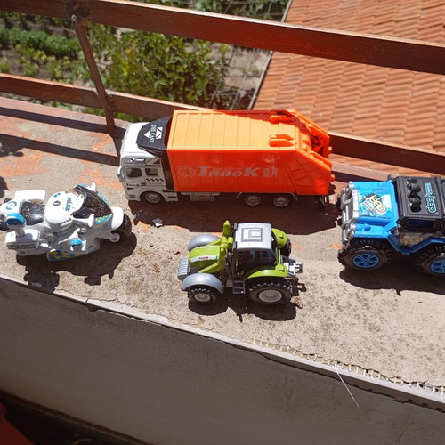 Lot of 4 used medium-sized children's toy vehicles