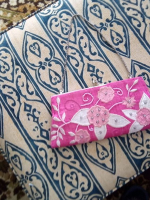 Bag like new with embroidered embossed designs in pink shades