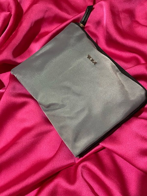 Tumi toiletry bag new, gray with black and purple interior, unisex