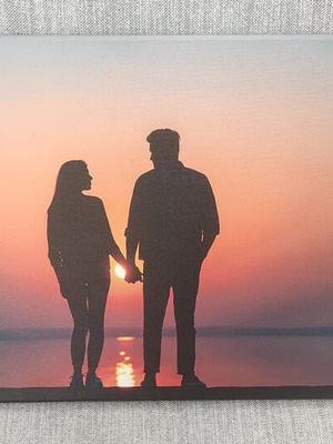 Canvas print Against the Sunset new romantic couple silhouette