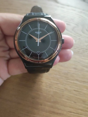Swatch Black Nachtigall wristwatch YWB403, black dial with rose gold accents