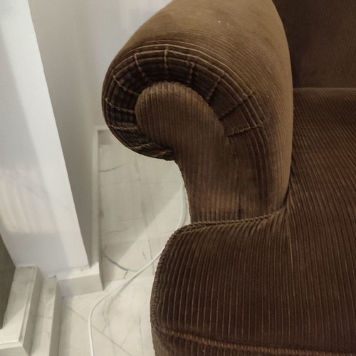 Handmade sofa used with brown velvet upholstery and walnut legs