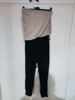 One-piece jumpsuit used medium beige and black with belt loops