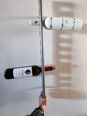 Wall-mounted metal wine rack 12 bottles, unused with slight marks