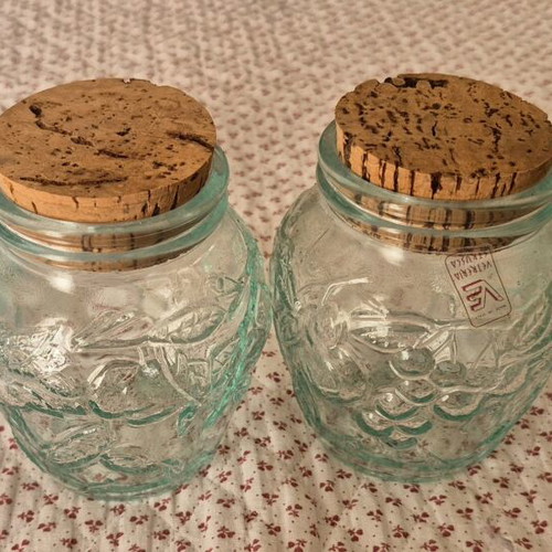 Glass jars like new, set of 4 with embossed designs