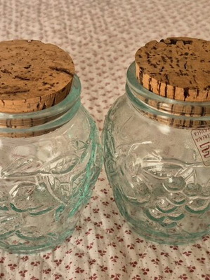 Glass jars like new, set of 4 with embossed designs