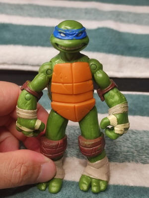 Leonardo Teenage Mutant Ninja Turtle figure used, missing shell