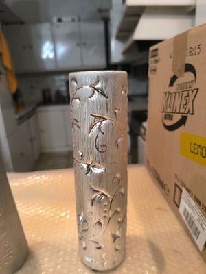 Ceramic cylindrical candle holder like new with decorative openings GIF1022