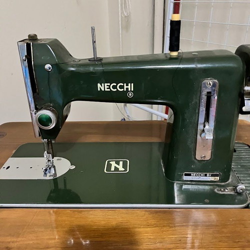 Necchi sewing machine used with antique cabinet, fully functional