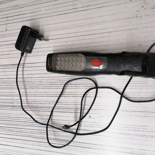 Professional flashlight with charger used