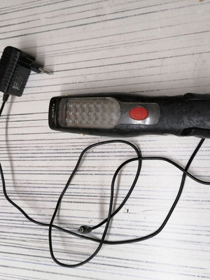 Professional flashlight with charger used