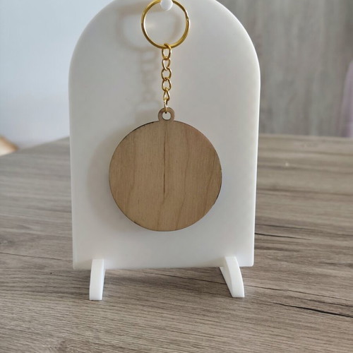 Handmade wooden summer keychain with laser cut sun and waves design