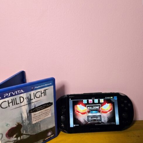 Sony PS Vita Slim console with 8GB card and games