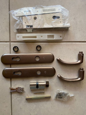Set of interior door handles and locks, new, coffee brown and champagne