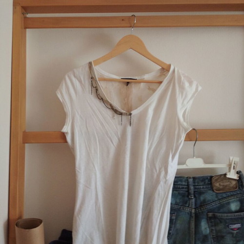 White blouse with lace back and decorative chain, size M