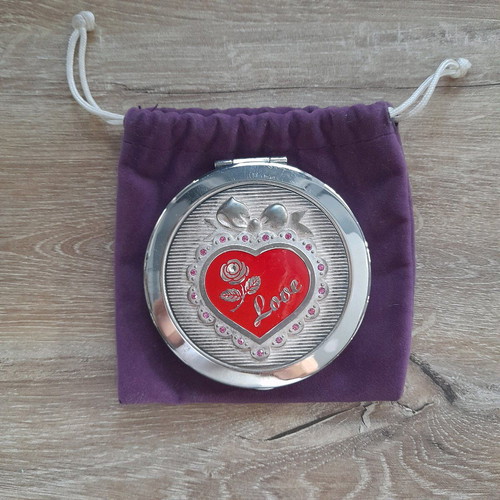 Compact mirror for bag used with purple velvet pouch