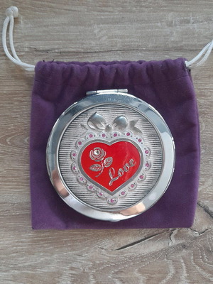 Compact mirror for bag used with purple velvet pouch