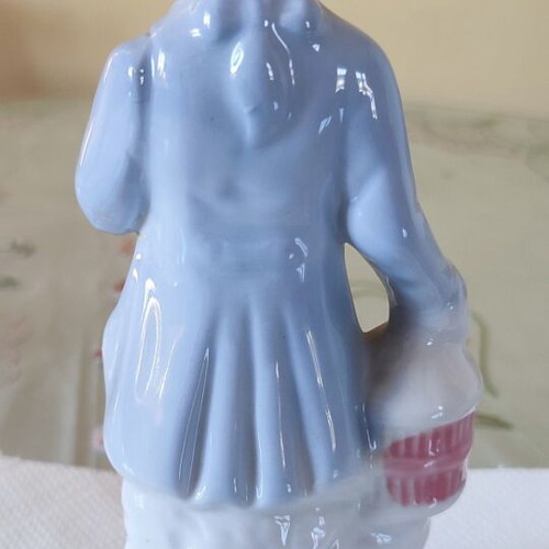 Vintage porcelain figurine Victorian man with bird and cage