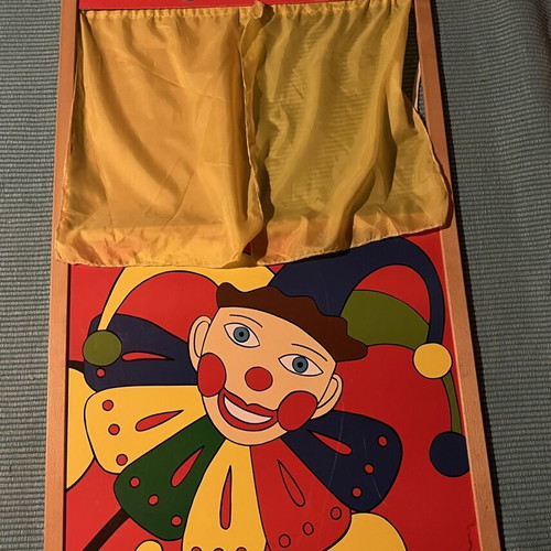 Used puppet theater with wear and missing support side