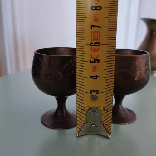 Vintage brass set with jugs, glass, and vase from India