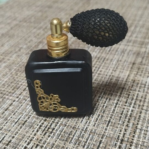 Vintage perfume bottle empty, like new, black with gold details
