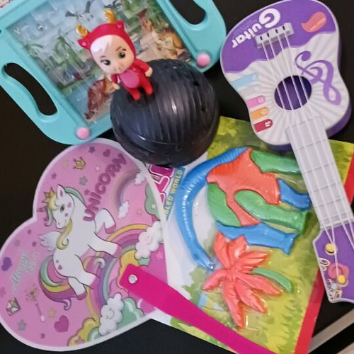 Gift set of 5 items like new with doll, ukulele, fan, puzzle and marble game