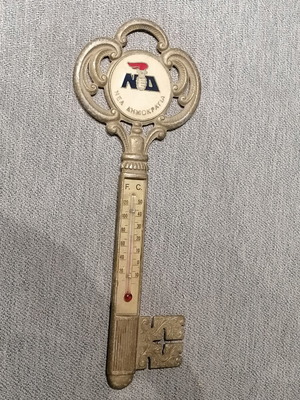 Thermometer wall key shaped used with New Democracy political emblem