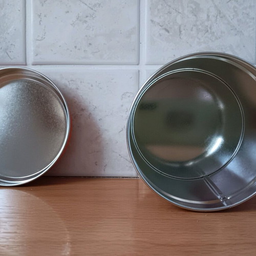 Metal biscuit tin like new with orange lid and designs