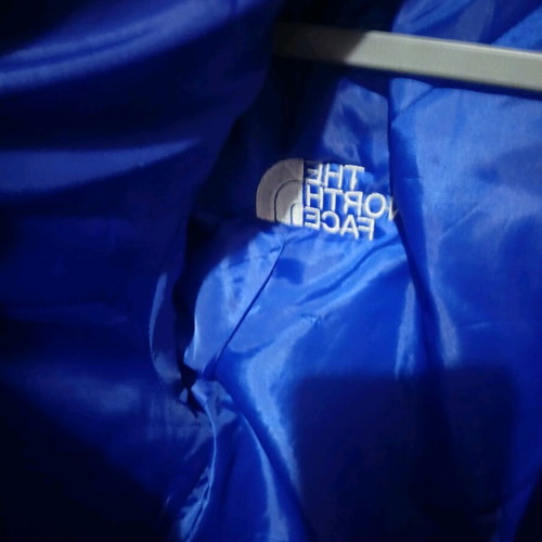 The North Face blue jacket like new, size M unisex