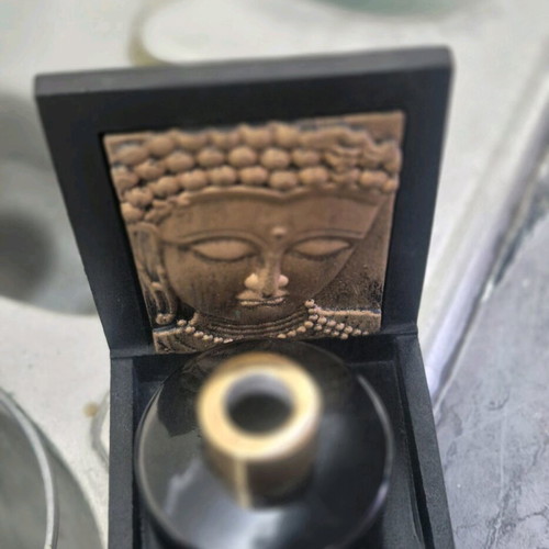 Decorative Buddha base like new with black glass bottle 100ml