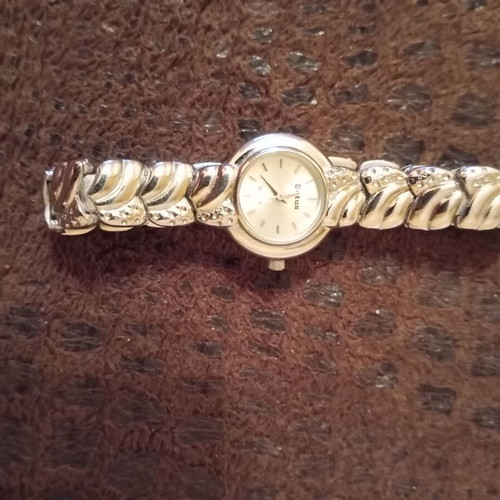 Women's elegant silver watch like new with bracelet and white stones