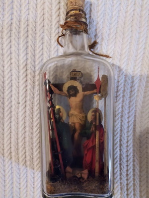 Old bottle with the Crucified used