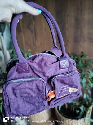 Bag waterproof material purple like new