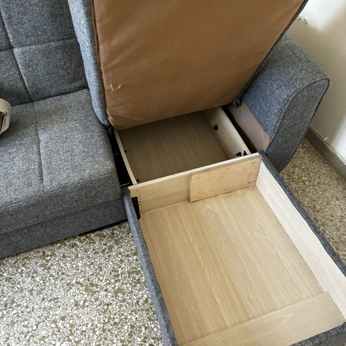 Corner sofa bed with storage compartments
