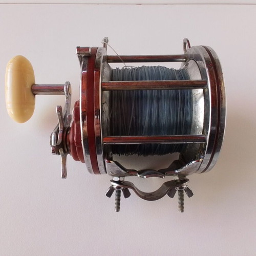 Penn Senator 114H fishing reel with large set of unused artificial lures and soft baits