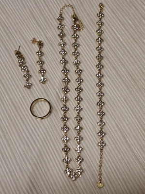 Jewelry set new with necklace, ring, earrings and bracelet with four-leaf clover