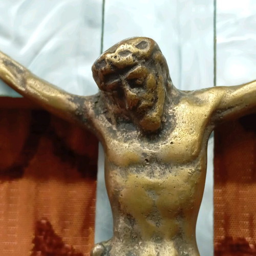 Old wooden crucifix used with bronze and light