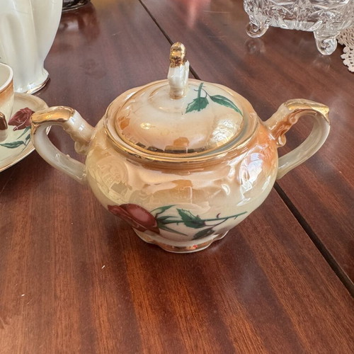 Vintage porcelain tea set with flowers and gold details, like new