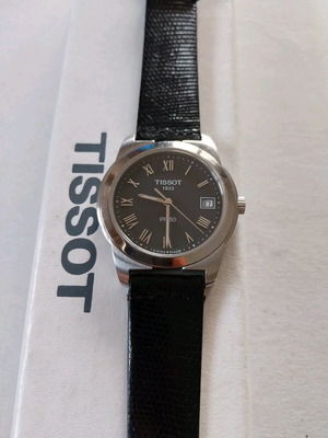 TISSOT men's quartz watch like new with new strap and battery