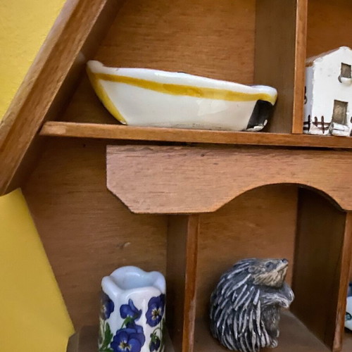 Decorative wall shelf with miniature collection case used