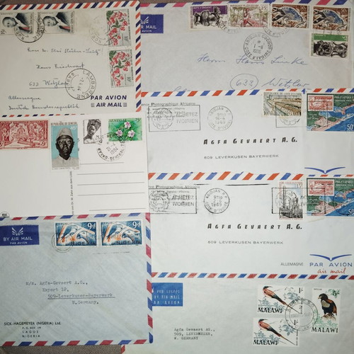 Collection of envelopes and stamps from around the world, new