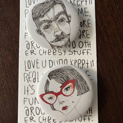 Two new unused pins, white and red