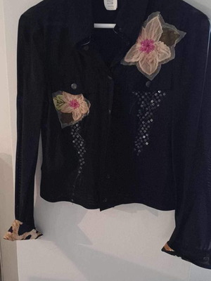 Black jacket used with leopard and floral details, size 46