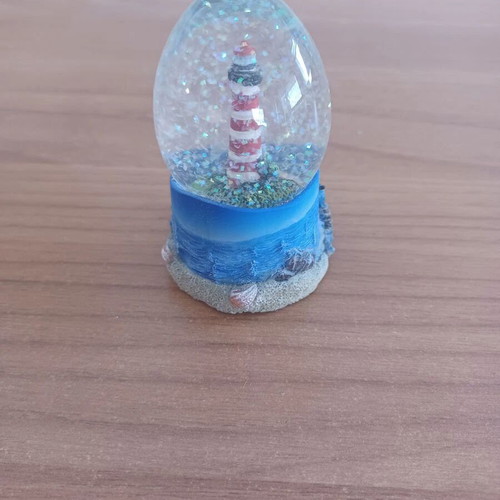 Ceramic lighthouse snow globe decorative item like new