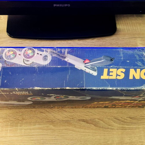 Retro game console used, complete with cartridge and controller