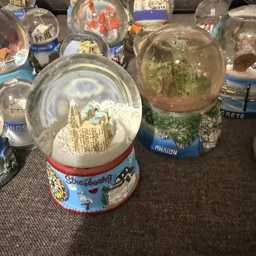 Tourist souvenir snow globes new from various world and Greek locations