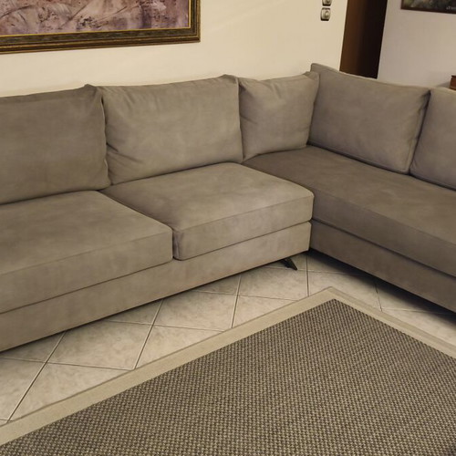 Corner sofa like new in grey/beige taupe color with decorative pillows