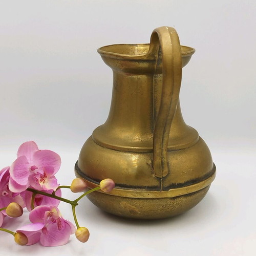 Old bronze pitcher used, vintage vase