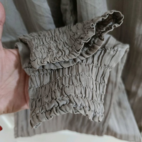 Strapless jumpsuit used, gray brown with bow and ruffles