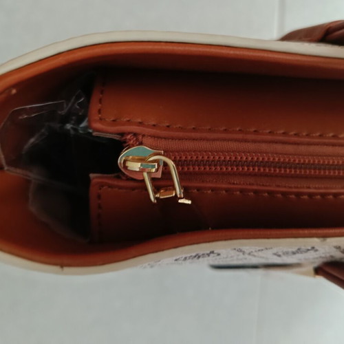 Beige shoulder bag with brown details